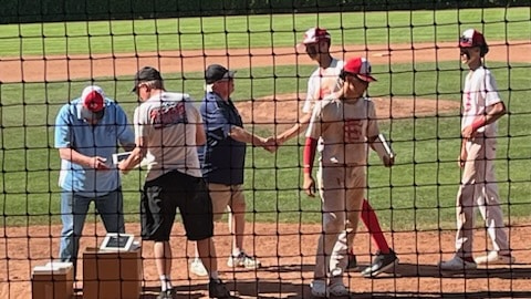 Tournament Director Steve Meyer congratulating players along with Tournament Volunteers Drew Aspegren and Rick Stice. Napa Valley Baseball Club photo